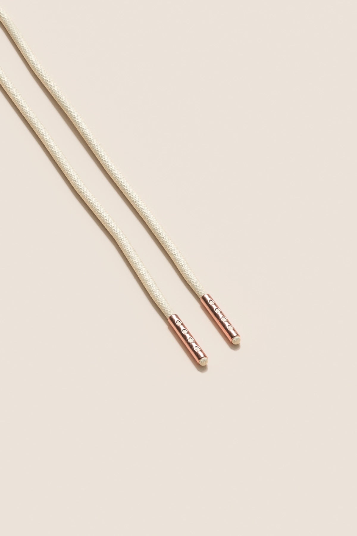 Senkels Cream 2.5mm Round Waxed Shoelaces with Rose Gold Aglets