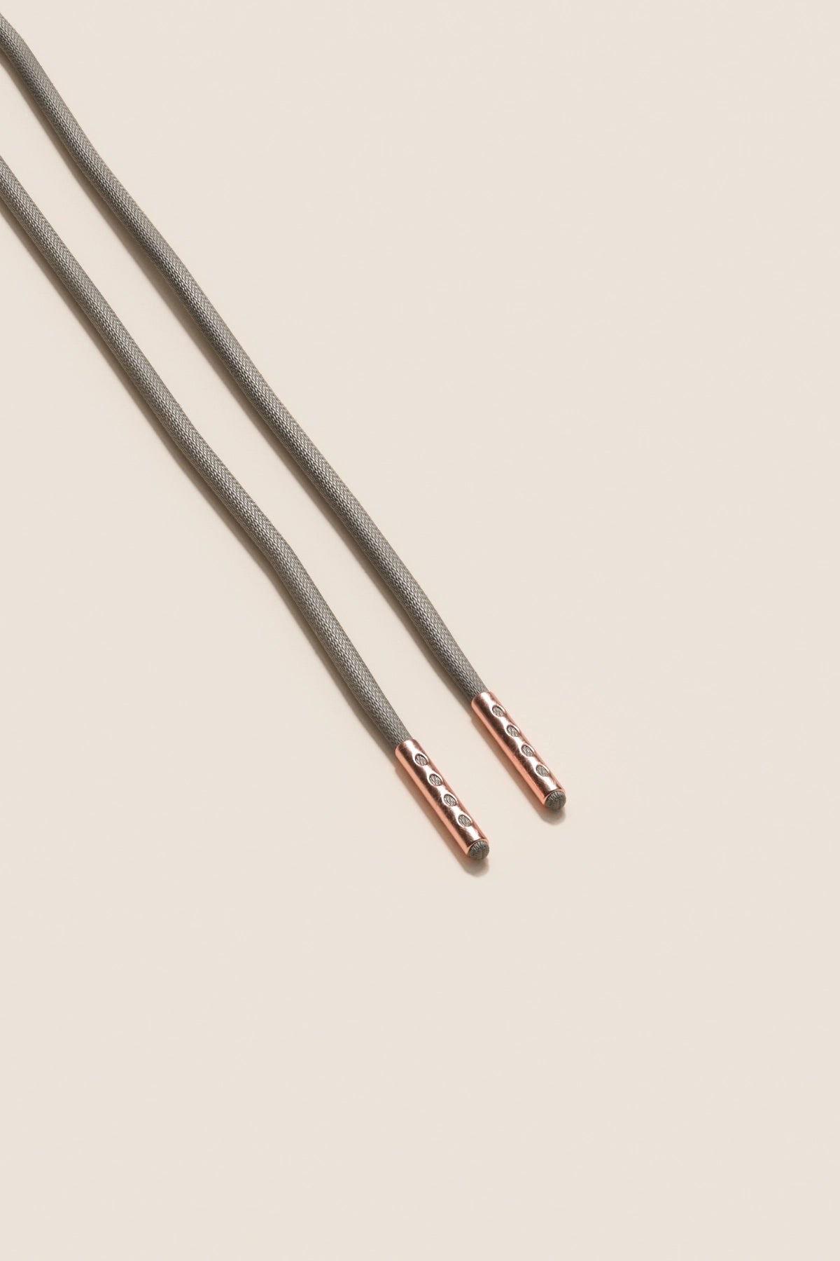 Senkels Graphite Grey 2.5mm Round Waxed Shoelaces with Rose Gold Aglets
